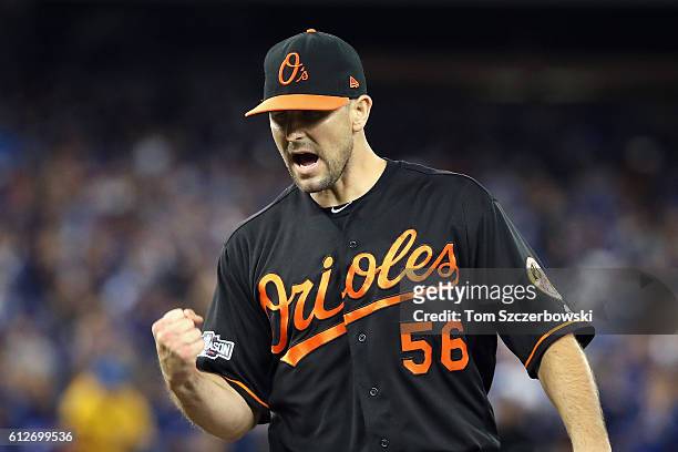 Darren O'Day of the Baltimore Orioles reacts after a double play in the ninth inning during the American League Wild Card game against the Toronto...