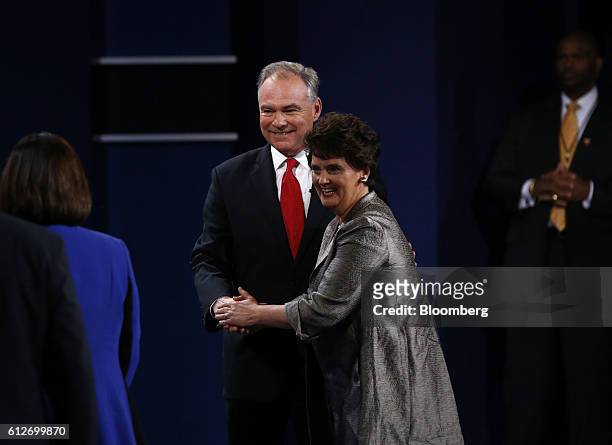 Tim Kaine, 2016 Democratic vice presidential nominee, center, stands on stage with wife Anne Holton during the vice presidential debate at Longwood...