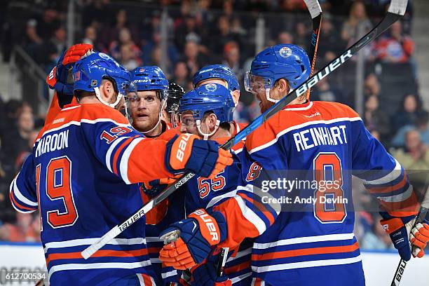 Patrick Maroon, Mark Fayne, Mark Letestu and Griffin Reinhart of the Edmonton Oilers celebrate after a goal during a preseason game against the...