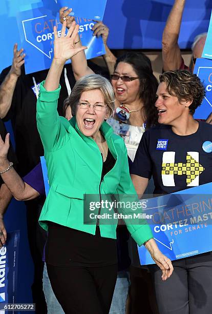 Sen. Elizabeth Warren waves as she arrives at The Springs Preserve on October 4, 2016 in Las Vegas, Nevada. Warren is campaigning for Democratic...