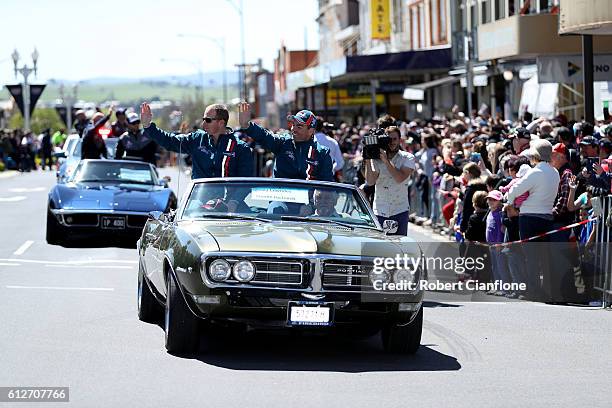 Steven Richards and Craig Lowndes of Team Vortex wave to the crowd during the drivers parade ahead of the Bathurst 1000, which is race 21 of the...