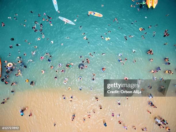 aerial view of people at the beach - aerial beach people stockfoto's en -beelden