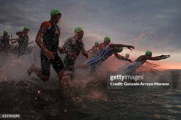 Pro athletes start the swimming course of the Ironman Barcelona on October 2, 2016 in Calella, Spain.