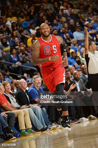 Marreese Speights of the Los Angeles Clippers runs the court against the Golden State Warriors during a preseason game on October 4, 2016 at ORACLE...