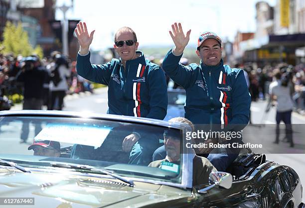 Steven Richards and Craig Lowndes of Team Vortex wave to the crowd during the drivers parade ahead of the Bathurst 1000, which is race 21 of the...