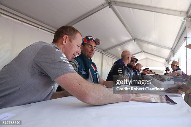 Steven Richards driver of the Team Vortex Holden signs autographs during the drivers autograph session ahead of the Bathurst 1000, which is race 21...