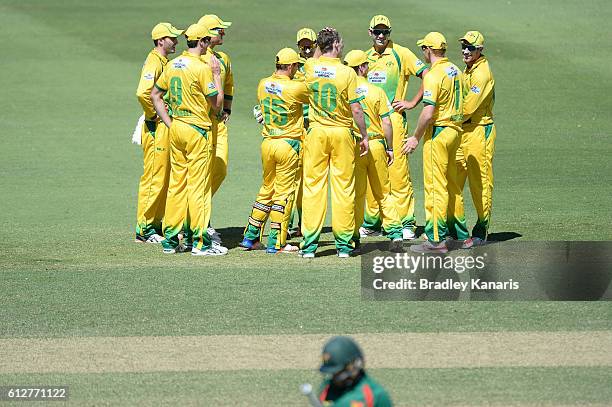 Brendan Doggett of CA XI celebrates with team mates after taking the wicket of Ben Dunk of Tasmania during the Matador BBQs One Day Cup match between...