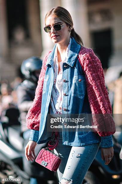 Chiara Ferragni is wearing blue denim jeans, a pink and blue denim jacket, and a pink Chanel bag, outside the Chanel show, during Paris Fashion Week...