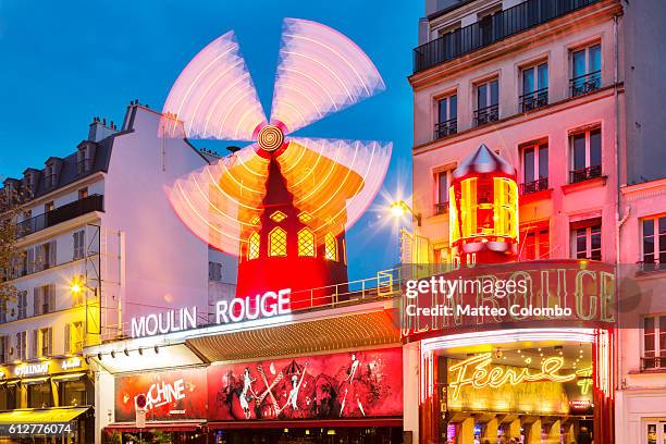 famous moulin rouge at night, paris, france - the place pigalle in paris stock pictures, royalty-free photos & images