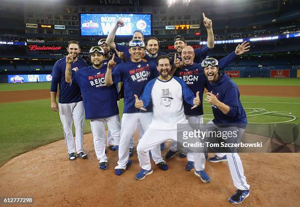 Toronto Blue Jays pitchers and coaches celebrate after defeating the Baltimore Orioles 5-2 in the eleventh inning to win the American League Wild...