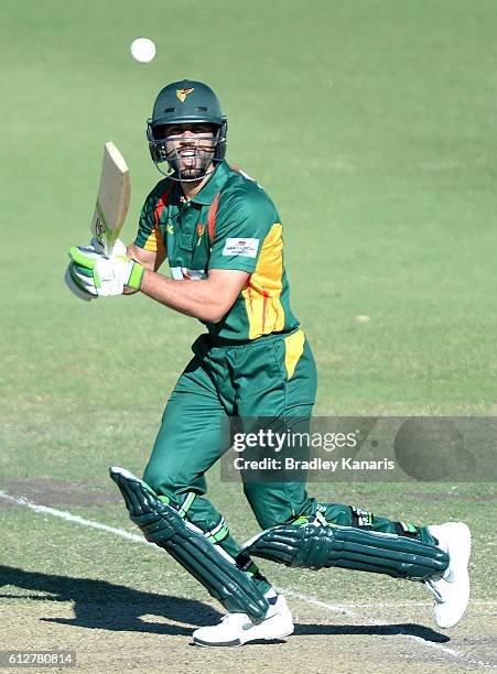 Dominic Michael of Tasmania plays a shot during the Matador BBQs One Day Cup match between Tasmania and the Cricket Australia XI at Allan Border...