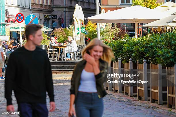 Restaurant and bar with people in the Old Town and Brick Wall on September 02, 2016 in Riga, Latvia "n