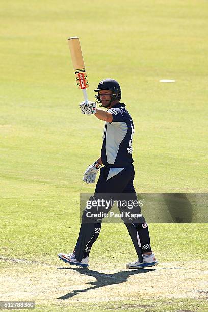 Cameron White of the Bushrangers raises his bat after scoring his century during the Matador BBQs One Day Cup match between South Australia and...