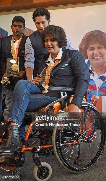 Rio Paralympics Silver medal winner Deepa Malik along with former Indian cricketer Sachin Tendulkar during a felicitation ceremony at MCA, on October...