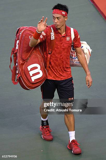 Kei Nishikori of Japan leaves the court after announcing withdrawal from the men's singles second round match against Joao Sousa of Portugal on day...