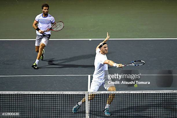 Dominic Inglot of Great Britain and Jean-Julien Rojer of Netherlands in action during the men's doubles second round match against Marcel Granollers...
