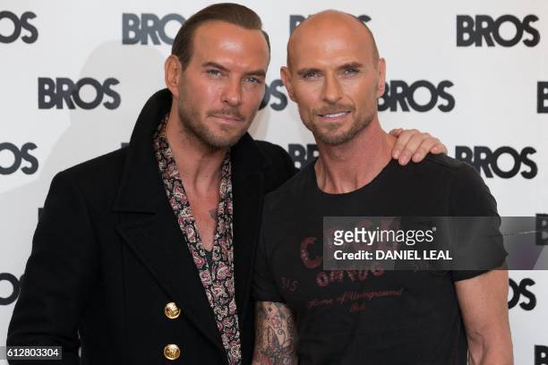 British singers Matt Goss and Luke Goss, from the British band Bros, pose together during a photo-call at the Yam Yard Hotel in central London on...