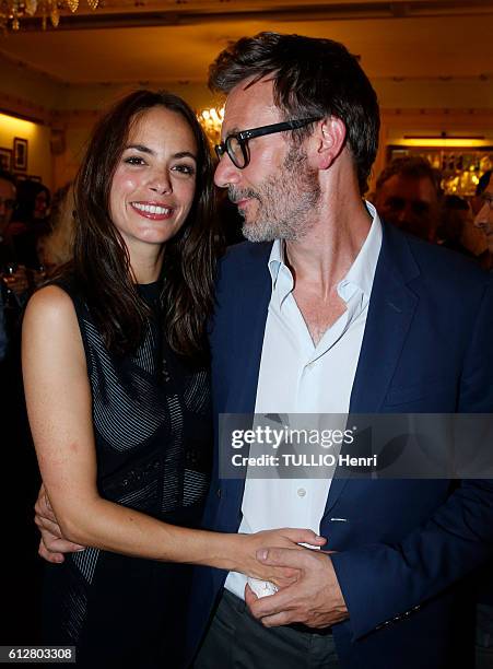 At the evening gala for the drama Tout ce que vous voulez at the theater Edouard-VII, Berenice Bejo and her husband Michel Hazanavicius pose for...