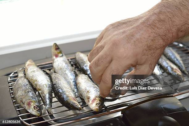 grilling sardines at home - fumes cooking stock pictures, royalty-free photos & images