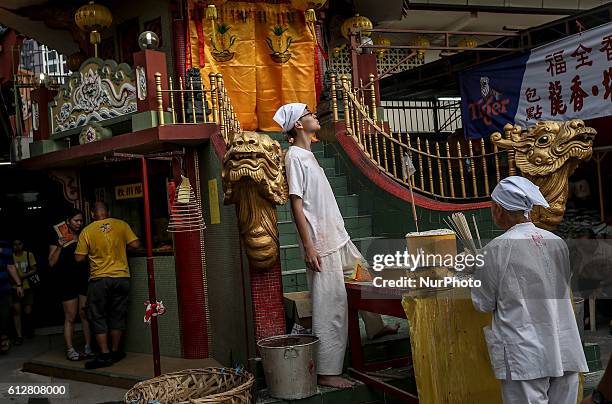 Devotee offers prayer to welcome Chinese Nine Emperor Gods in Kuala Lumpur October 5, 2016.