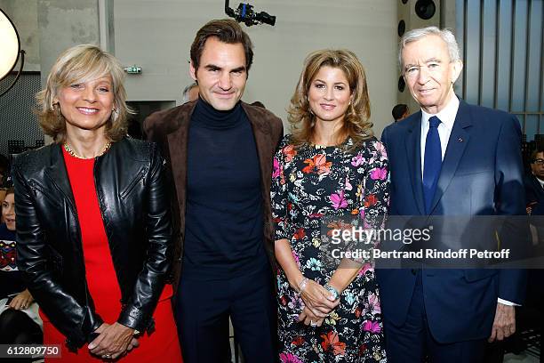 Tennis player Roger Federer and his wife Mirka Federer standing between Owner of LVMH Luxury Group Bernard Arnault and his wife Helene attend the...