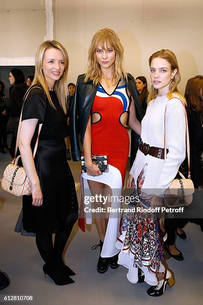 Louis Vuitton's executive vice president, Delphine Arnault, models Karlie Kloss and Natalia Vodianova attend the Louis Vuitton show as part of the...