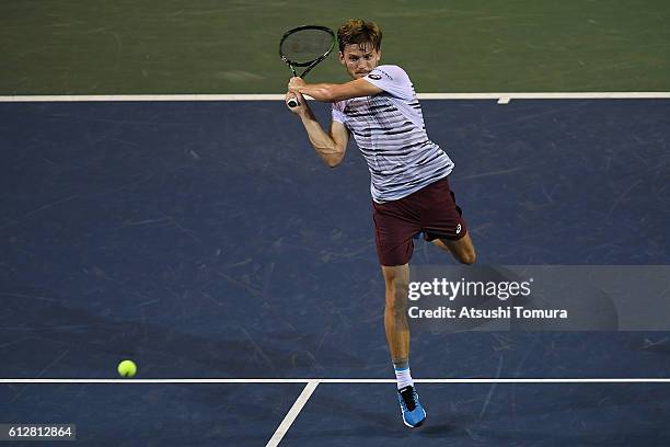 David Goffin of Belgium plays a backhand after winning the men's singles second round match against Jiri Vesely of Czech Republic on day three of...