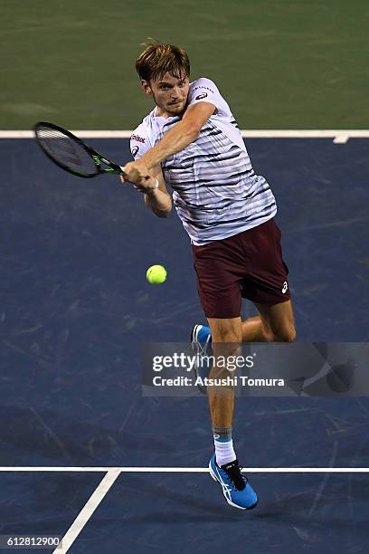 David Goffin of Belgium plays a backhand after winning the men's singles second round match against Jiri Vesely of Czech Republic on day three of...