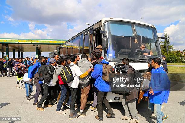 Refugees, who can't go to Hungarian border, take a bus to return Belgrade during their walk to Hungarian border with Serbia near the region of...