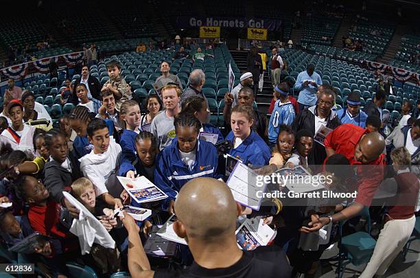 Guard David Wesley of the Charlotte Hornets signs autographs before the NBA game against the Boston Celtics at Charlotte Colesium in Charlotte, North...