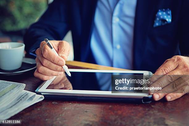 businessman is working using his tablet - newspaper luxury bildbanksfoton och bilder