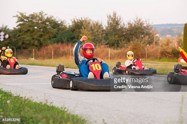 friends at amusement park - go carting stock pictures, royalty-free photos & images