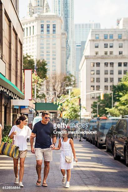 real family walking in the streets of new-york in summer. - travel real people stockfoto's en -beelden