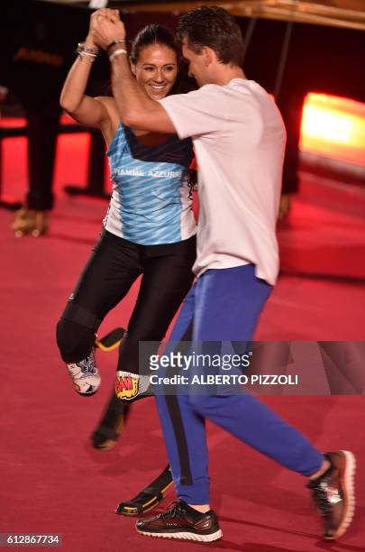 Italian paralympics athlete Giusy Versace dances before the arrival of Pope Francis during the opening ceremony of a Vatican seminar on sport and...