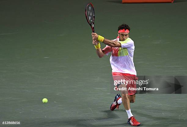 Juan Monaco of Argentina plays a backhand during the men's singles second round match against James Duckworth of Australia on day three of Rakuten...