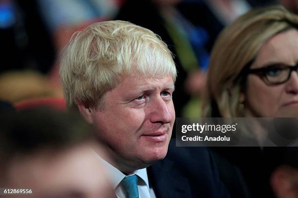 Conservative Party MP Secretary of State and Commonwealth Affairs Boris Johnson reacts as British Prime Minister Theresa May starts to deliver a...