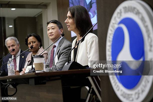 Deborah Hersman, president and chief executive officer of the National Safety Council, from right, speaks during a panel discussion with David Kim,...