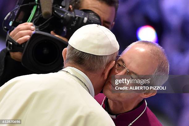 Pope Francis his greeted by Archbishop of Canterbury Justin Welby as he arrives for the opening ceremony of a Vatican seminar on sport and society in...