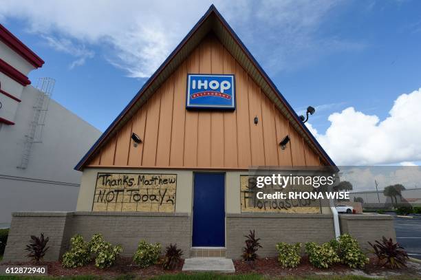 Boarded up IHOP restaurant has messages to Hurricane Matthew written on the plywood as it sits closed ahead of Hurricane Matthew on Cocoa Beach,...