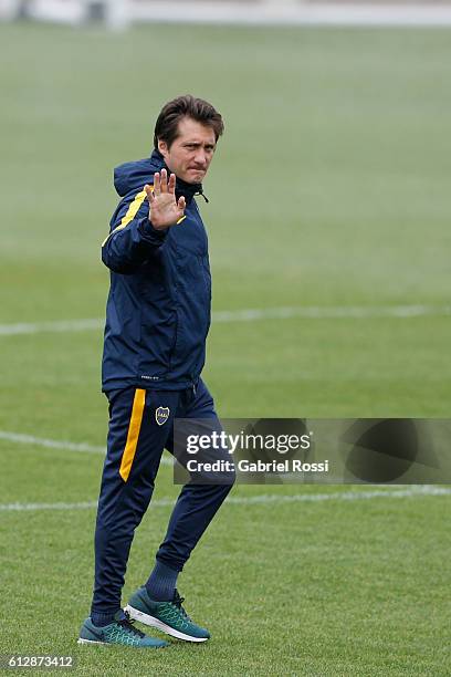 Coach of Boca Juniors Guillermo Barros Schelotto greets during a Boca Juniors training session at Complejo Pedro Pompilio on October 05, 2016 in...