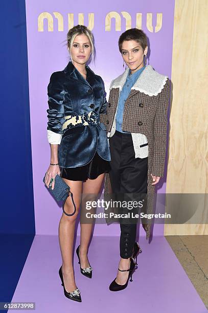 Lala Rudge and a guest attend the Miu Miu show as part of the Paris Fashion Week Womenswear Spring/Summer 2017 on October 5, 2016 in Paris, France.