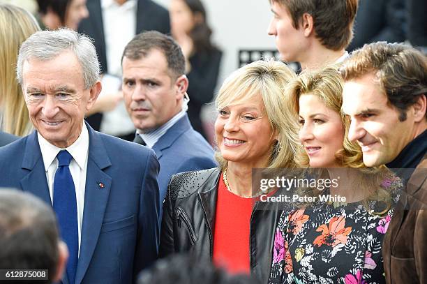 Bernard Arnault, Helene Mercier, Miroslava Vavrinec and Roger Federer attend the Louis Vuitton show as part of the Paris Fashion Week Womenswear...