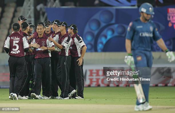 Somerset playerscelebrate the wicket of Adam Gilchrist of the Chargers during the Airtel Champions League Twenty20 Group A match between the Deccan...