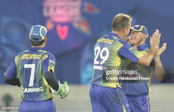 Herschelle Gibbs of the Cobras is congratulated, after he caught Dimitri Mascarenhas of Otago during the Airtel Champions League Twenty20 Group C...