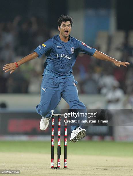 Shing of Deccan Chargers celebrates thw wicket of Justin Langer of Somerset during the Airtel Champions League Twenty20 Group A match between the...