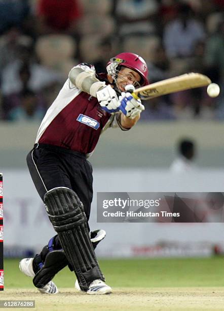 Justin Langer of Somerset drives through cover for four during the Airtel Champions League Twenty20 Group A match between the Deccan Chargers and...