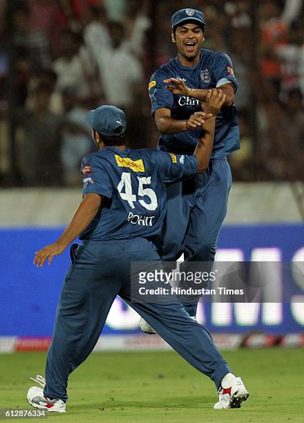 Rohit Sharma of the Chargers congratulates R P Singh on holding the catch to dismiss Peter Trego during the Airtel Champions League Twenty20 Group A...