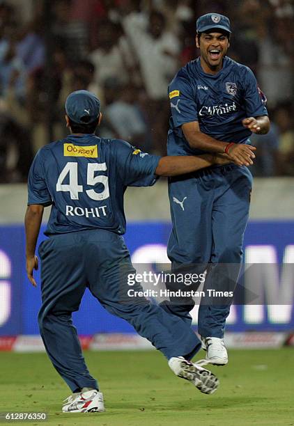 Rohit Sharma of the Chargers congratulates R P Singh on holding the catch to dismiss Peter Trego during the Airtel Champions League Twenty20 Group A...