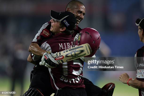 Alfonso Thomas of Somerset celebratesafter hitting the winning runs during the Airtel Champions League Twenty20 Group A match between the Deccan...