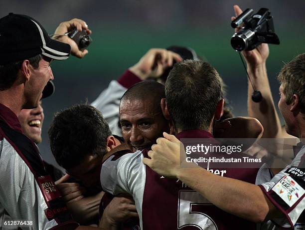 Alfonso Thomas of Somerset celebratesafter hitting the winning runs during the Airtel Champions League Twenty20 Group A match between the Deccan...